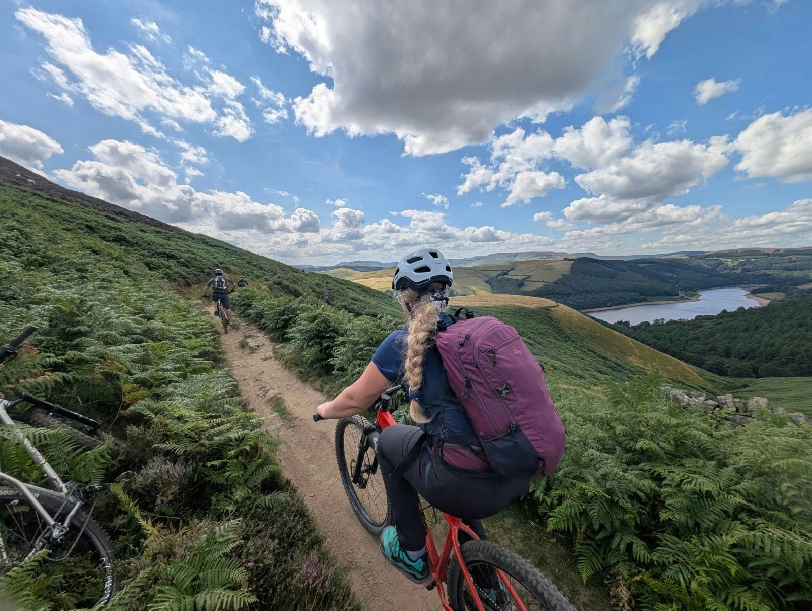 Mountain biker on singletrack above Ladybower Reservoir