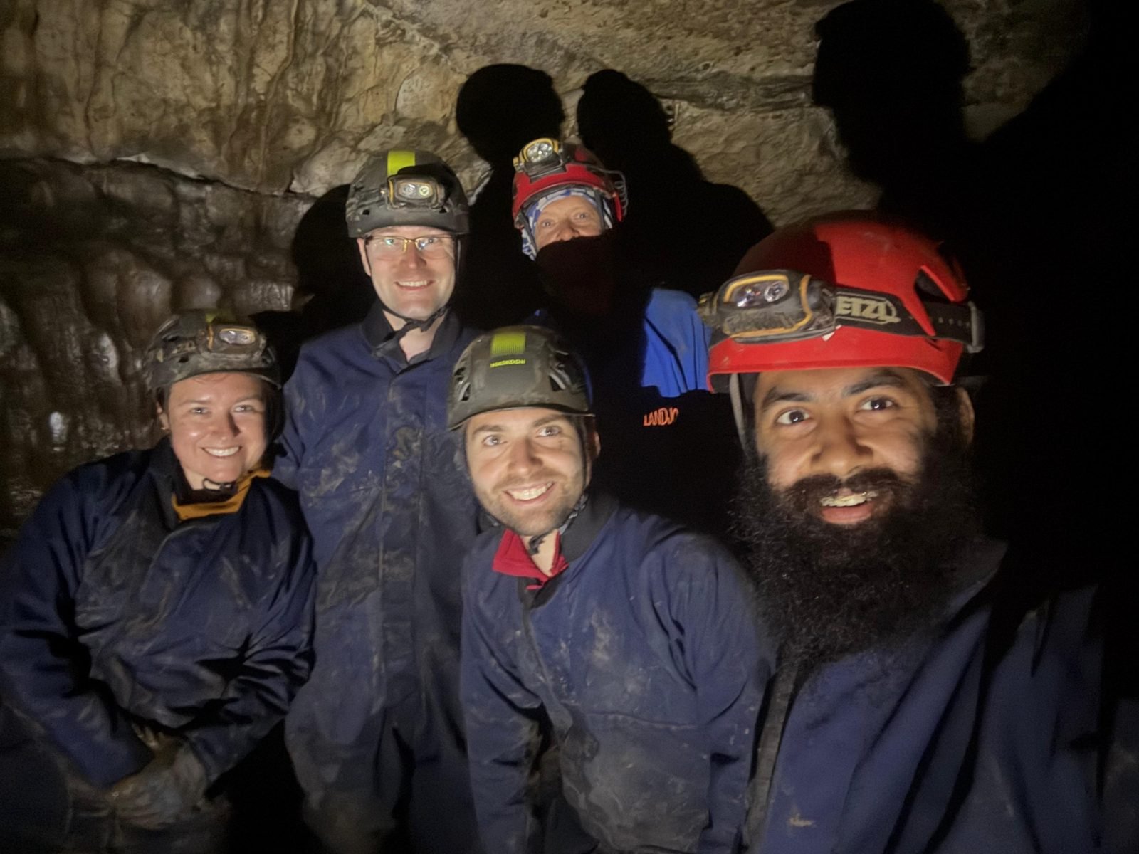 A group of beginner cavers underground in the Peak District