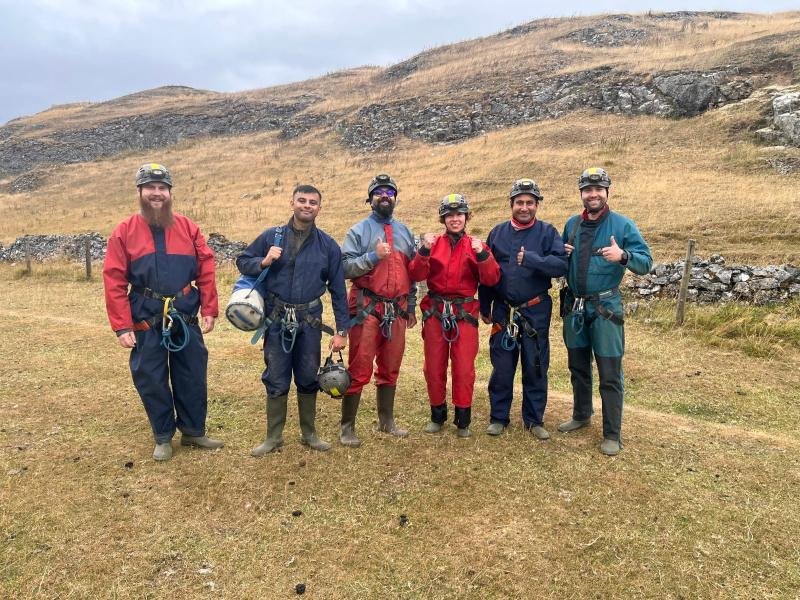 Cavers exploring a Peak District cave